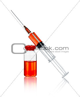 syringe and ampule with a red substance on the isolated white ba