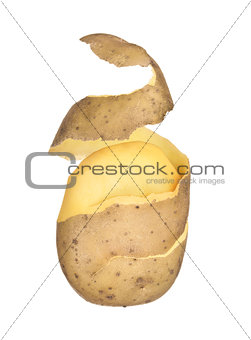 peeled potatoes with the peel in flying on an isolated white bac