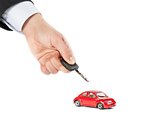 toy car and car key concept for insurance, buying, renting, fuel or service and repair costs 