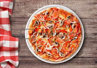 pizza with paprika and mushrooms top view on table with picnic t