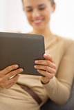 Closeup on young woman using tablet pc