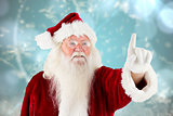 Composite image of santa claus pointing