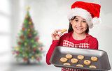 Composite image of festive little girl offering cookies