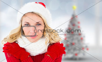 Composite image of happy festive blonde