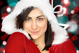 Composite image of pretty girl smiling in santa outfit