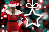Composite image of sexy santa girl with hand on hip