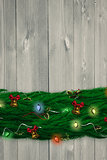 Composite image of fir branch christmas decoration garland