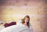 Composite image of pretty blonde relaxing on the couch