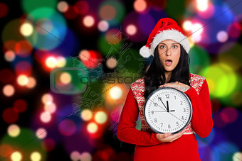 Composite image of woman shocked at the time