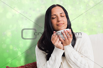 Composite image of woman enjoying a lovely drink