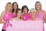 Composite image of smiling women posing and wearing pink for breast cancer