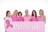 Composite image of smiling women wearing pink for breast cancer awareness