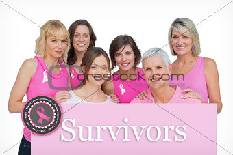 Composite image of happy women posing and wearing pink for breast cancer