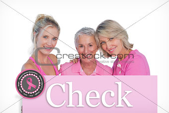 Composite image of happy women wearing pink tops and ribbons for breast cancer