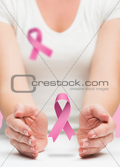 Woman presenting breast cancer awareness message
