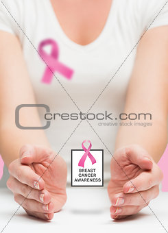 Woman presenting breast cancer awareness message