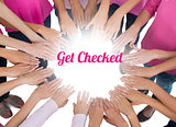 Hands joined in circle wearing pink for breast cancer