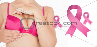 Composite image of closeup of woman performing self breast examination