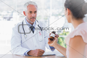 Composite image of patient holding jar of medicine