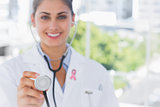 Composite image of pretty young doctor holding up stethoscope