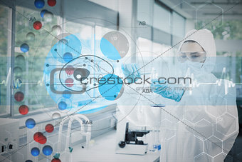 Composite image of scientist in protective suit working with cell diagram interface