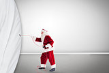 Santa pulls curtain with a rope