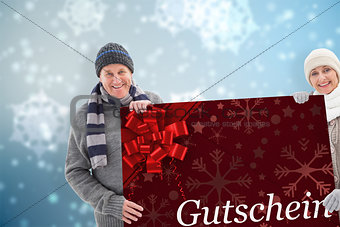 Composite image of winter couple showing poster