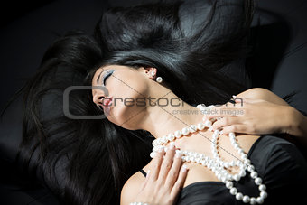 Glamour portrait of beautiful woman with pearl accessories
