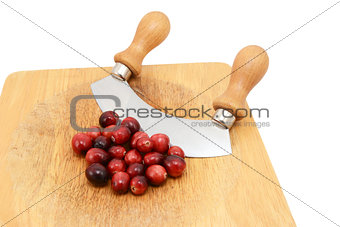 Whole fresh cranberries with a rocking knife