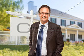 Male Real Estate Agent in Front of Blank Sign and House