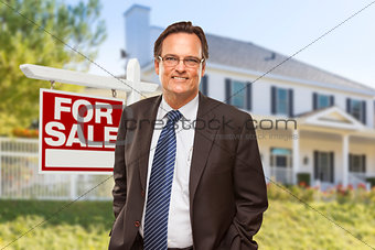 Real Estate Agent in Front of For Sale Sign, House