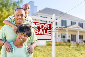 African American Family In Front of Sale Sign and House