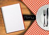 Menu with Notebook and White Plate