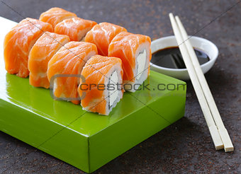 Sushi roll with red salmon and philadelphia cheese
