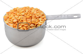 Yellow split peas in a cup measure