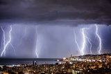 Night cityscape with strong lightning