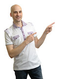 Man in polo t-shirt pointing to copy space