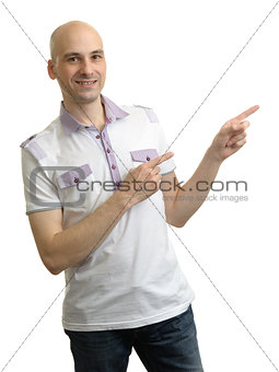 Man in polo t-shirt pointing to copy space