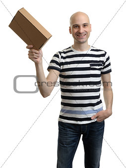 Smiling delivery man holding the box