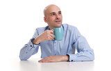 man drinking a cup of coffee or tea