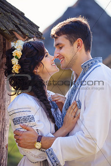 Romantic young couple in Ukrainian style clothes