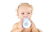 Cute baby girl drinking milk.
