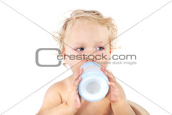 Cute baby girl drinking milk.
