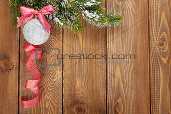 Christmas fir tree and bauble with red ribbon