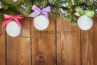Christmas fir tree and baubles with colorful ribbon