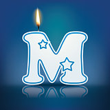 Candle letter M with flame