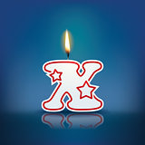 Candle letter x with flame