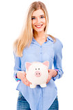 Beautiful woman holding  a piggy bank