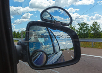 Reflection of sky with clouds in mirror.