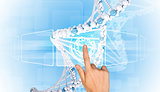 Hand finger presses on model of DNA